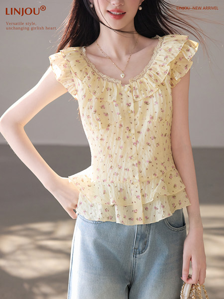 Model wearing a yellow floral ruffled sleeveless blouse