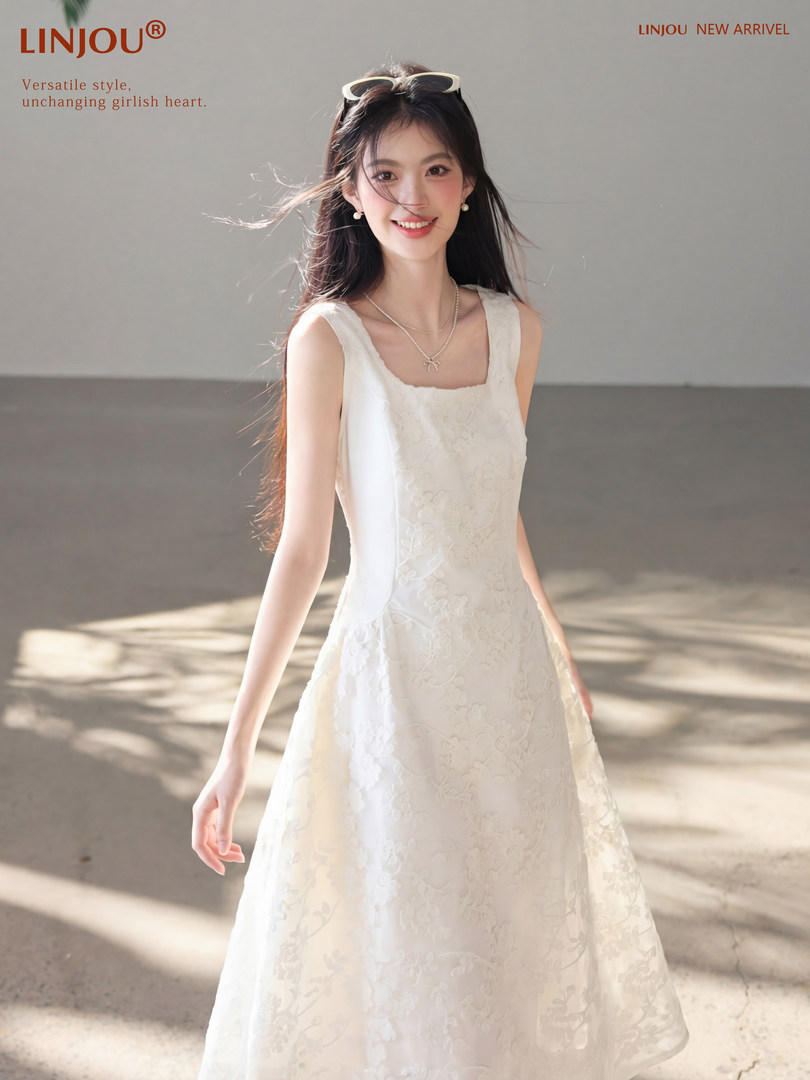White lace sleeveless dress worn by a female model