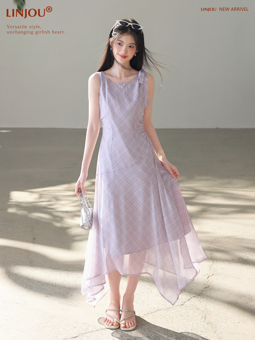 Model wearing a pastel lavender sleeveless flowy dress