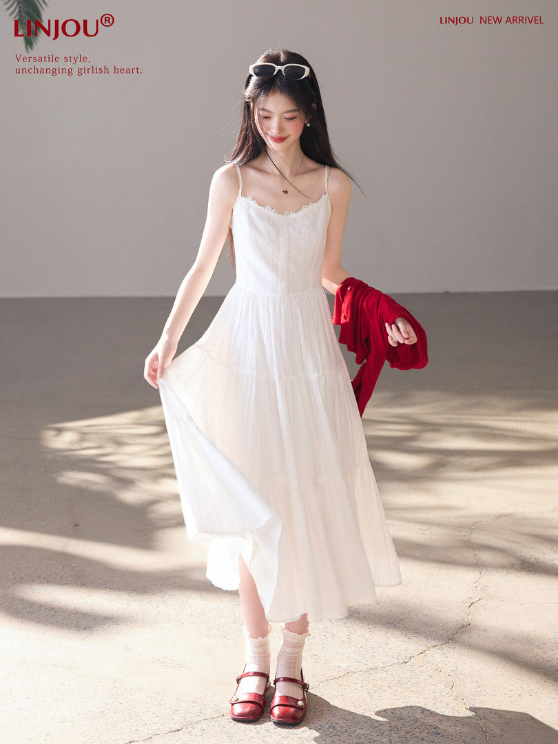 Model wearing a white sleeveless midi dress