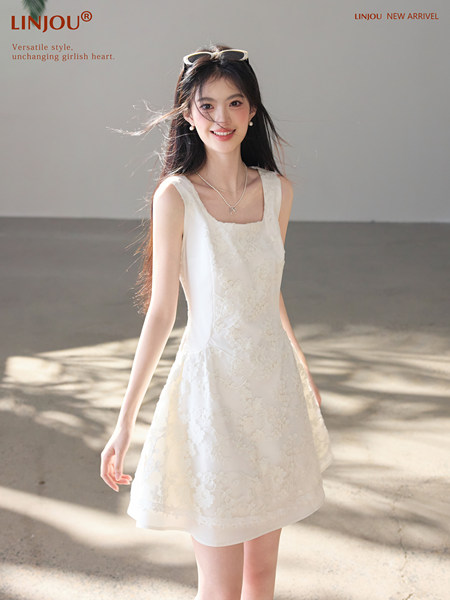 White sleeveless floral dress worn by a model with promotional text