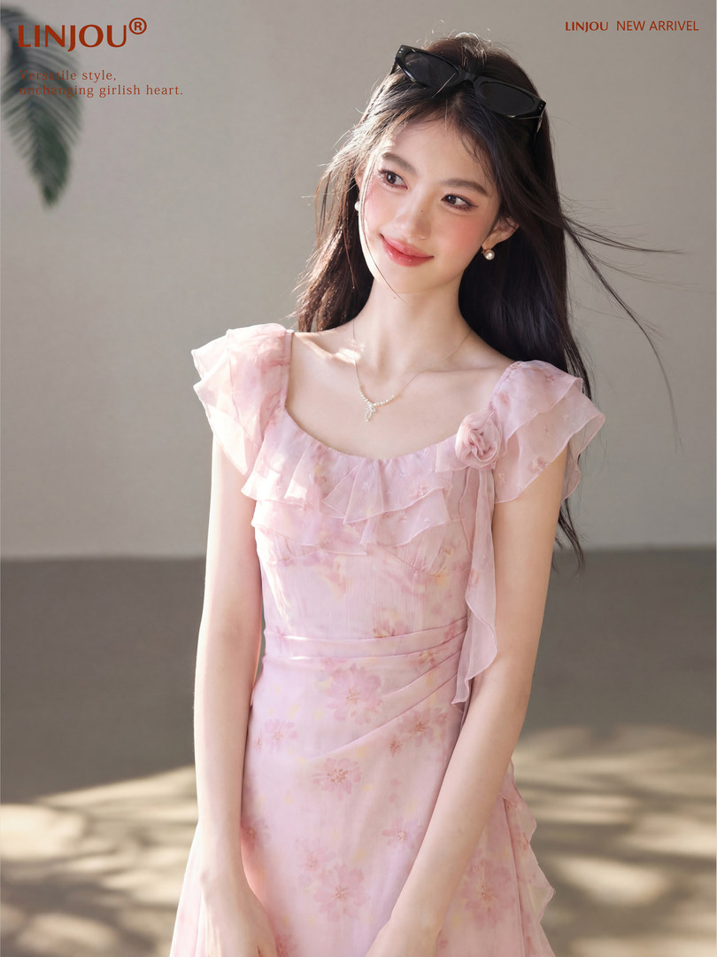 Pink floral ruffled dress worn by a model