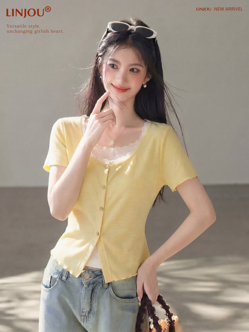 Model wearing a yellow short-sleeve button-front top with lace trim and jeans