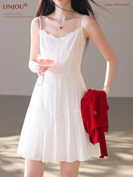 White sleeveless lace-trim sundress worn by a model
