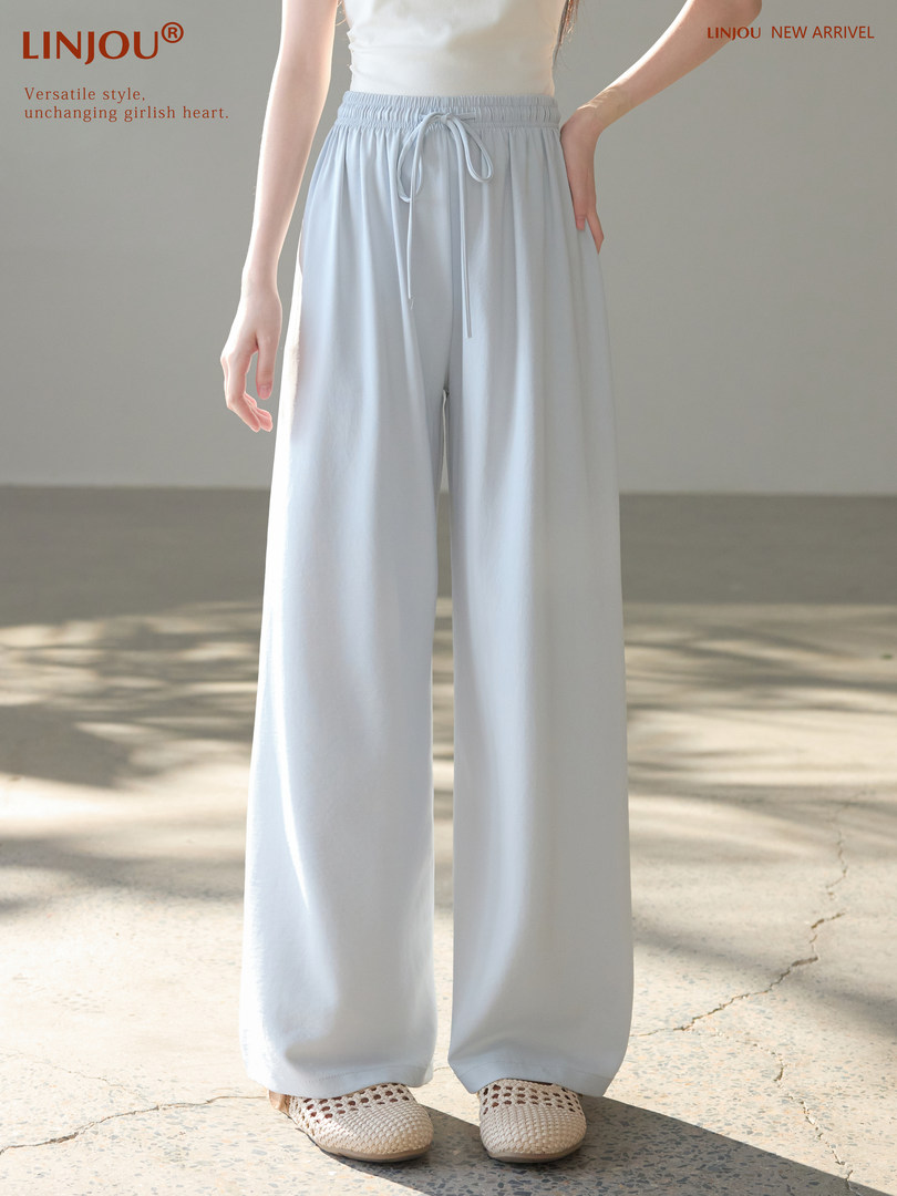 Light blue wide-leg drawstring pants worn by a model