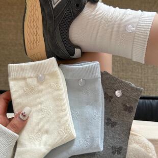 2026春夏新款韩版纯色立体暗花无骨蝴蝶结纽扣百搭棉质中筒袜子