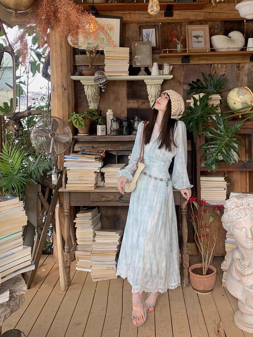 Light blue lace-trimmed maxi dress worn by a model