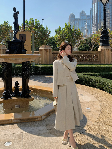 Cream tailored suit set worn by a woman outdoors