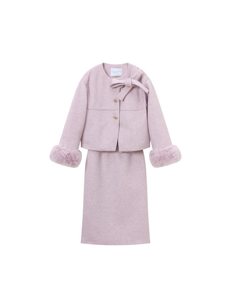 Light pink coat and skirt set with fur-trimmed sleeves and bow detail on white background