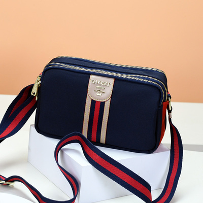 斜跨牛津布包包女撞色配皮小方包2025欧美时尚新款多层休闲单肩包