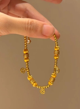 Young拉丝猫眼珠铜钱镀金色盘缠手链轻奢新中式抽拉钱币手饰品女