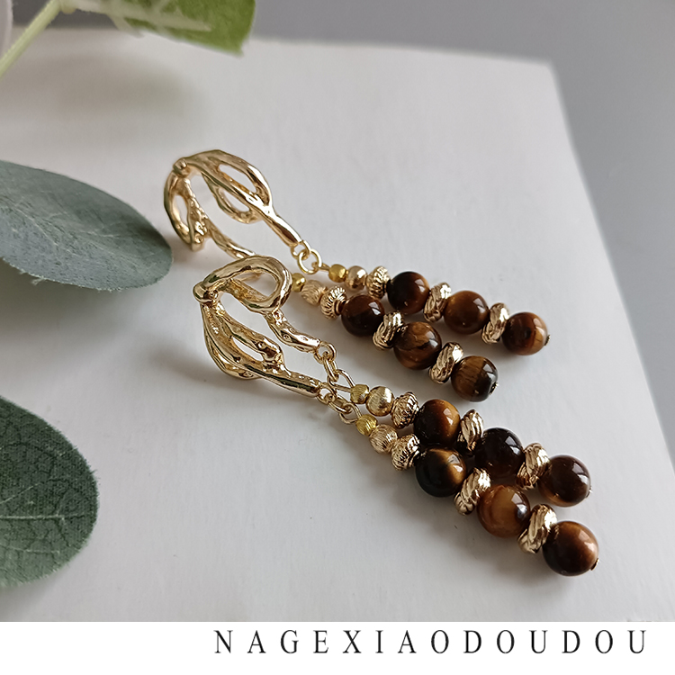 Y42渠道牛货重工虎睛石流苏铜镀真金蝴蝶结银针时髦复古大气耳环