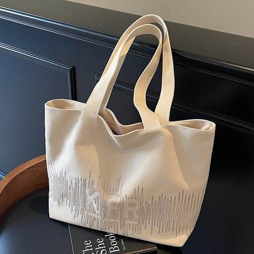 简约大容量托特包2025新款托特包韩版百搭帆布包上课单肩包手提包