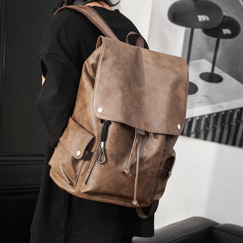 A man真皮黑色双肩包女2026新款高级感百搭大容量通勤旅行背包