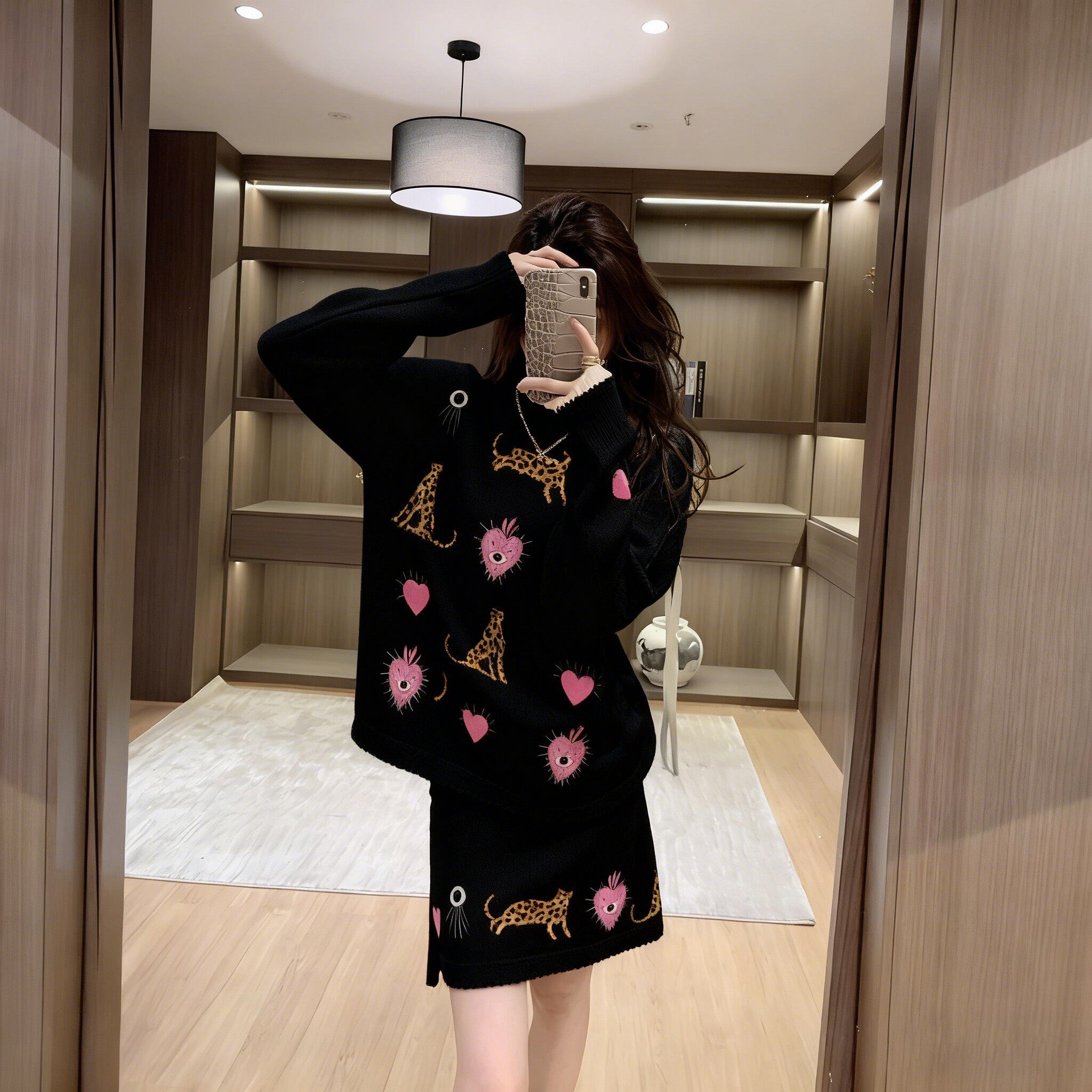 2025黑色卡通图案针织套装女秋冬慵懒风穿搭长袖上衣A字裙两件套