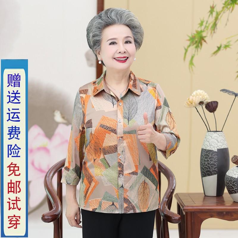 中年の女性は薄い七分袖のシャツの上着を出荷して、老人の老太シャツのお母さんは中高年の婦人服の夏を装っています。