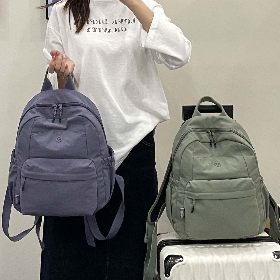 简约纯色小众超轻双肩包大容量休闲旅行背包大学生书包双肩背包
