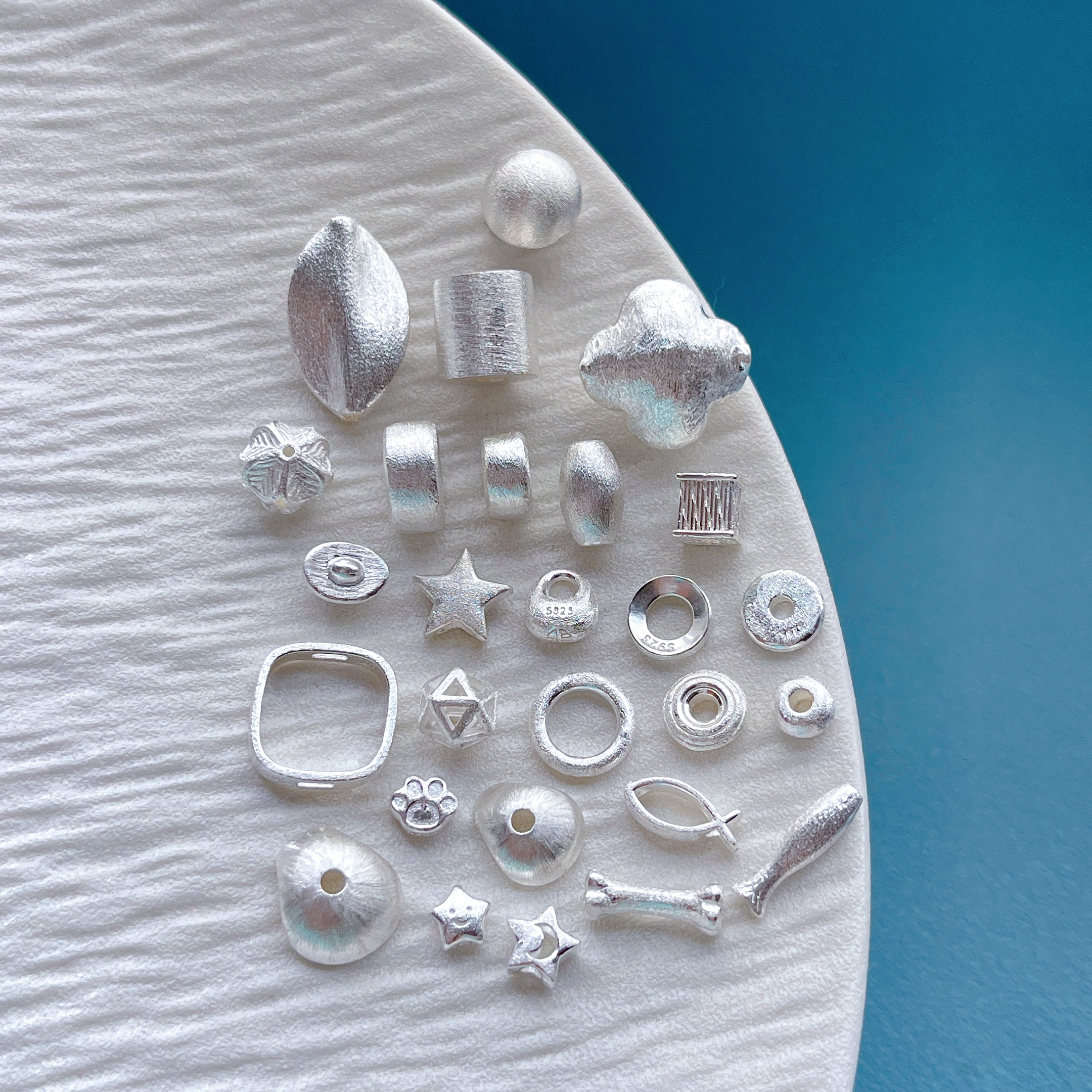 纯银拉丝四叶草花苞大孔跑环隔珠