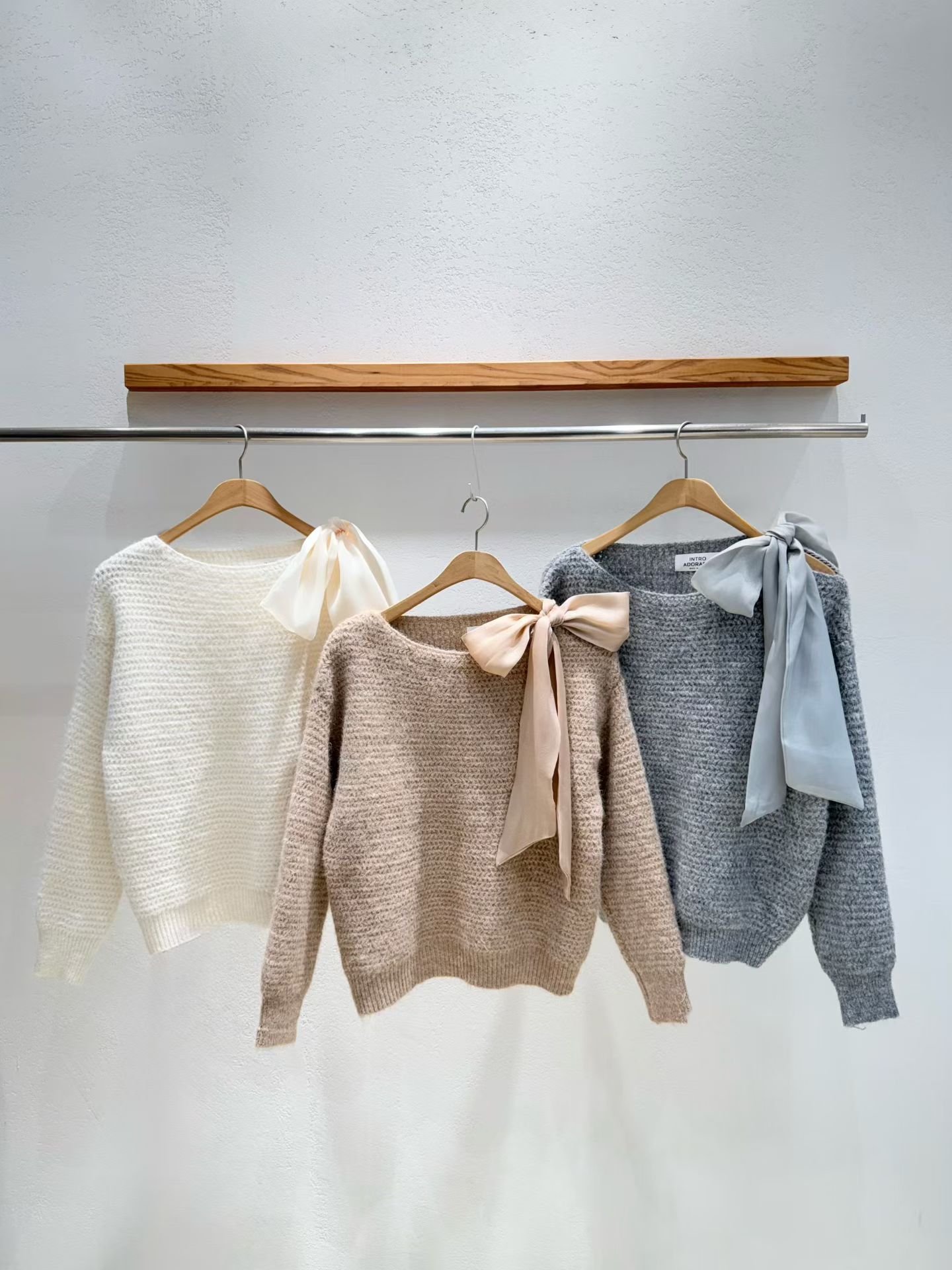 韩国东大门2025冬季新款INTRO时尚百搭纯色蝴蝶结针织衫毛衣