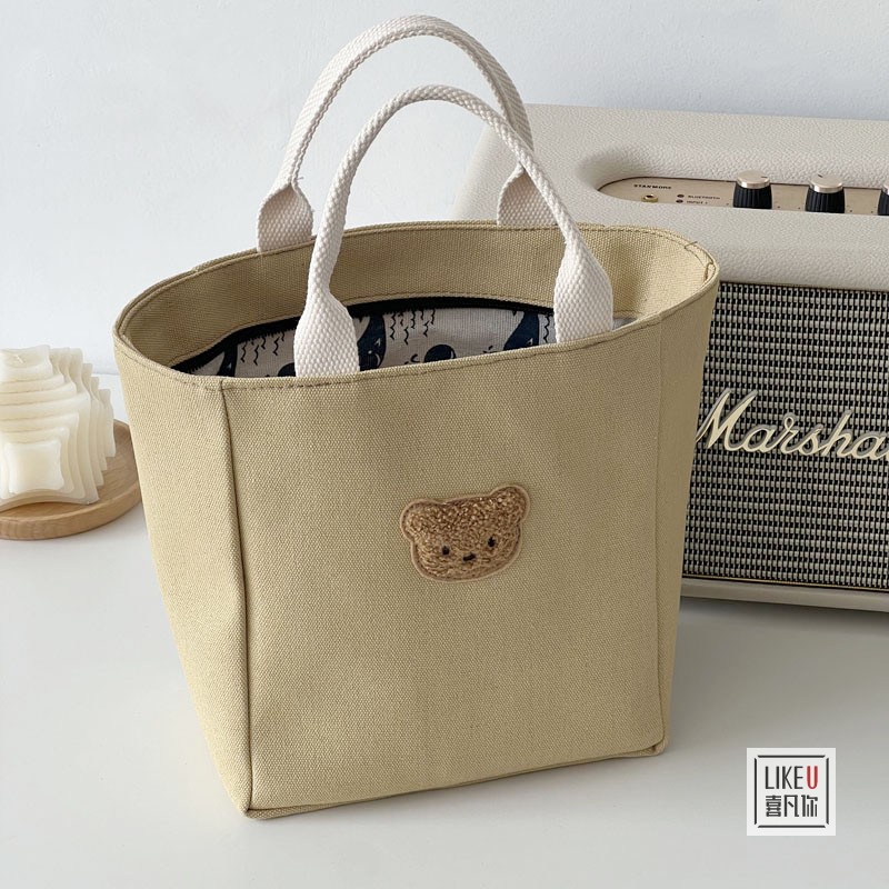 原创设计日系纯色帆布手提包小熊简约百搭文艺休闲学生便当餐盒包