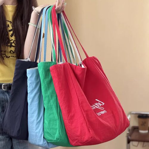 喜凡你条纹防水面料双面帆布包
