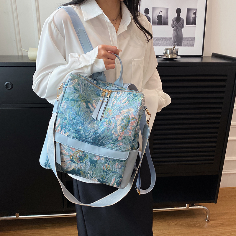 美式涂鸦双肩包女2025新款时尚潮流大容量织布背包印花两用单肩包
