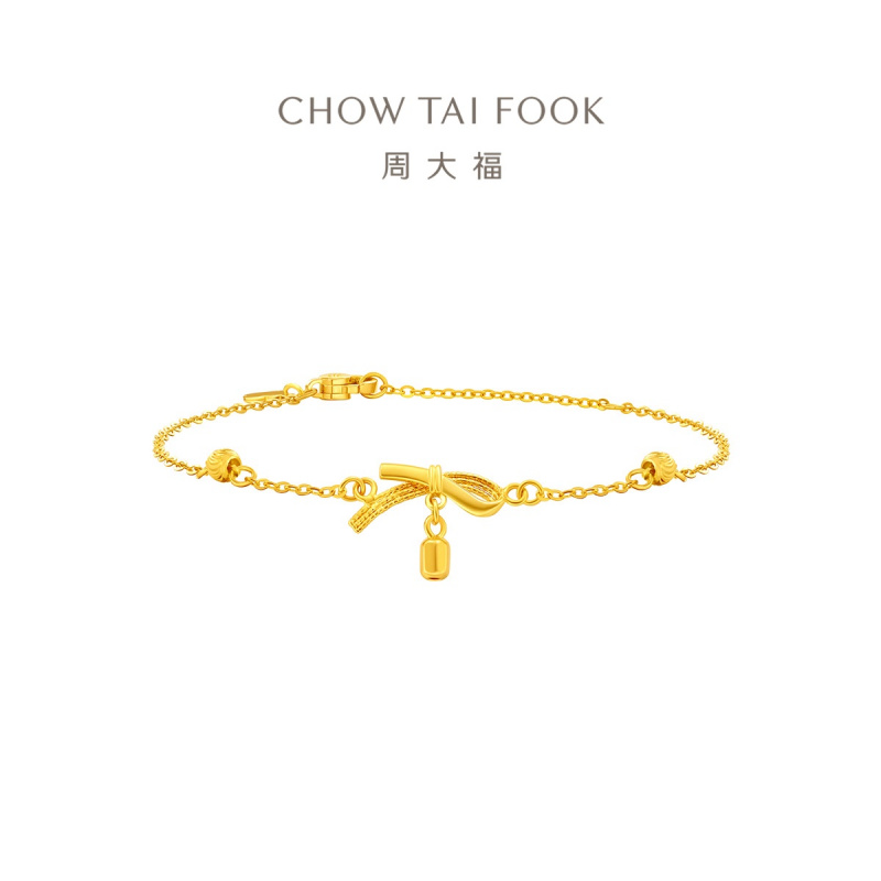周大福丝带蝴蝶结猫眼珠足金手链