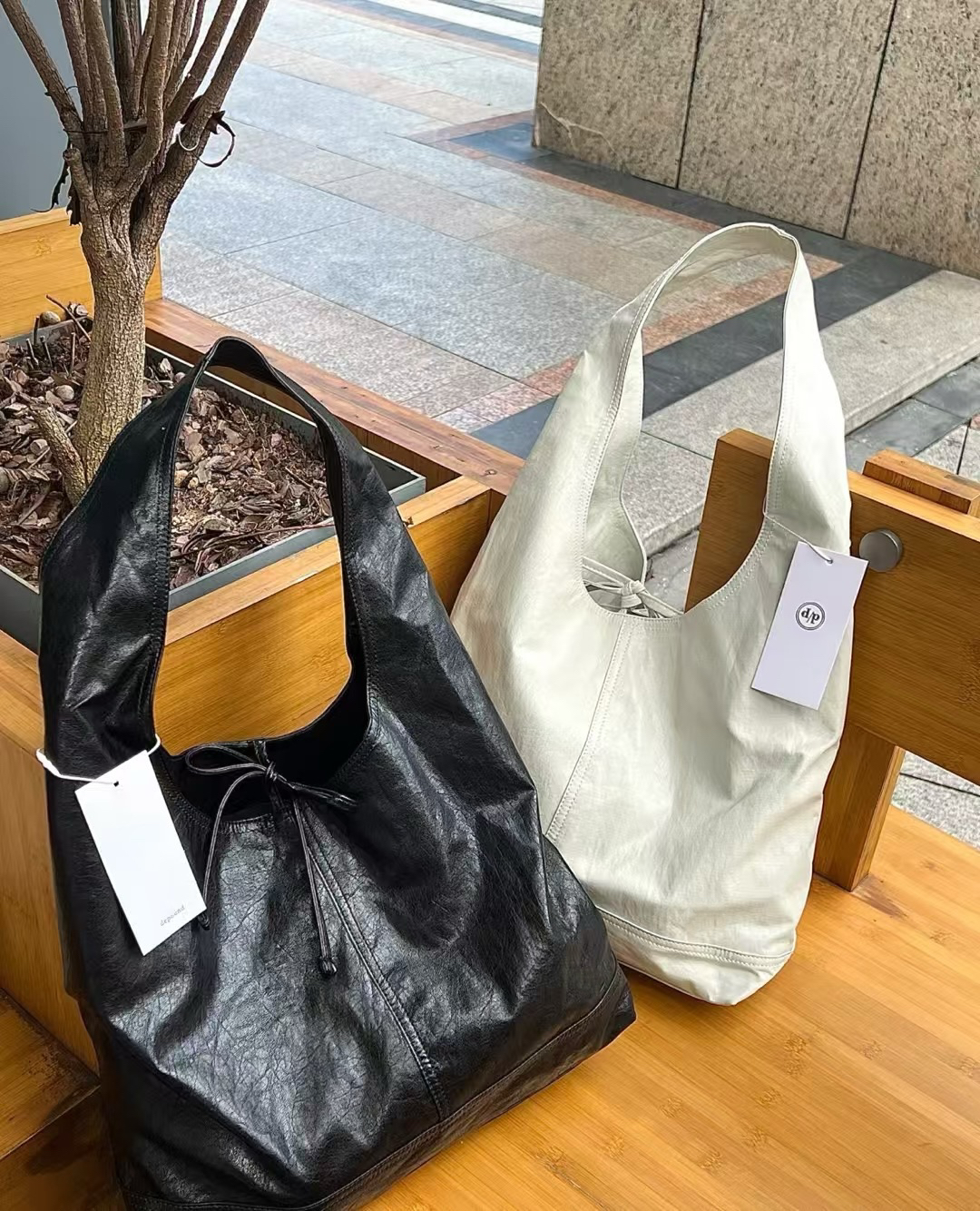 韩国depound蝴蝶结绑带三角流浪明星包法式慵懒托特包软皮手提包