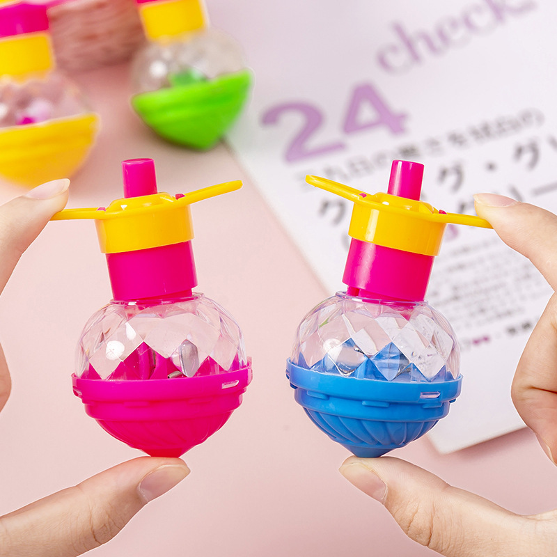 新款卡通儿童发光陀螺玩具简单手动拧转闪光七彩按压户外彩色旋转