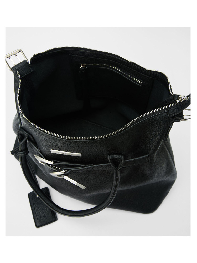 Black leather handbag on white background