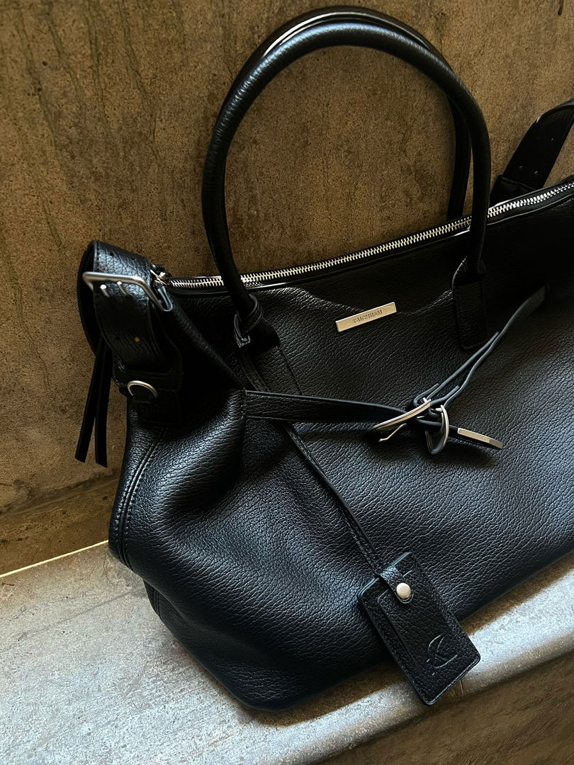 Black leather handbag with top handles and zipper detail