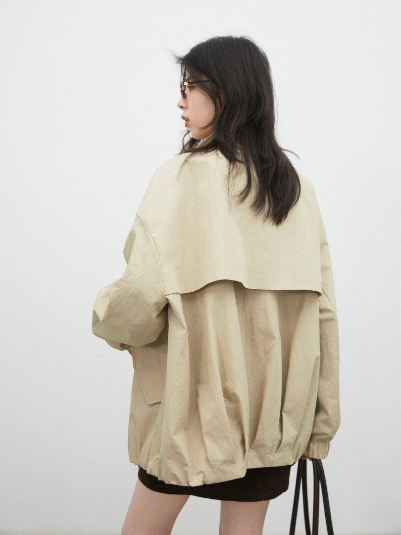 Beige lightweight oversized jacket worn by a model