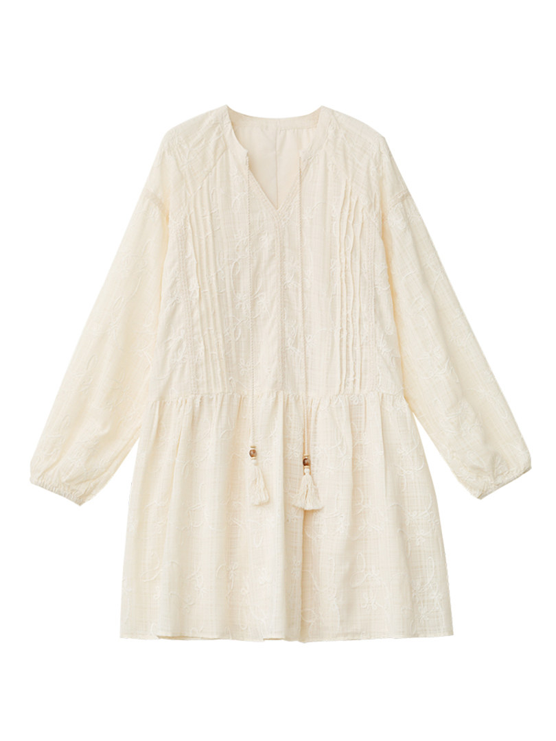Cream embroidered long-sleeve dress laid flat on a white background