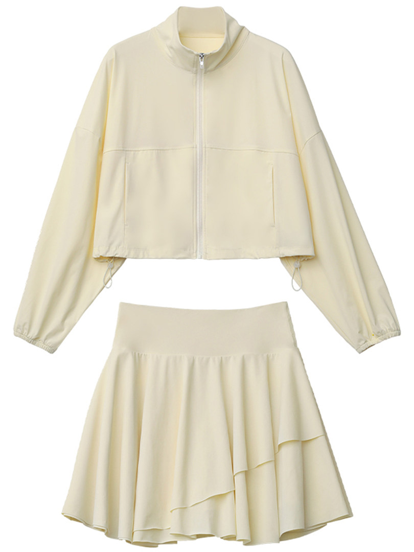Cream two-piece outfit with a zip-up jacket and matching flared skirt laid flat