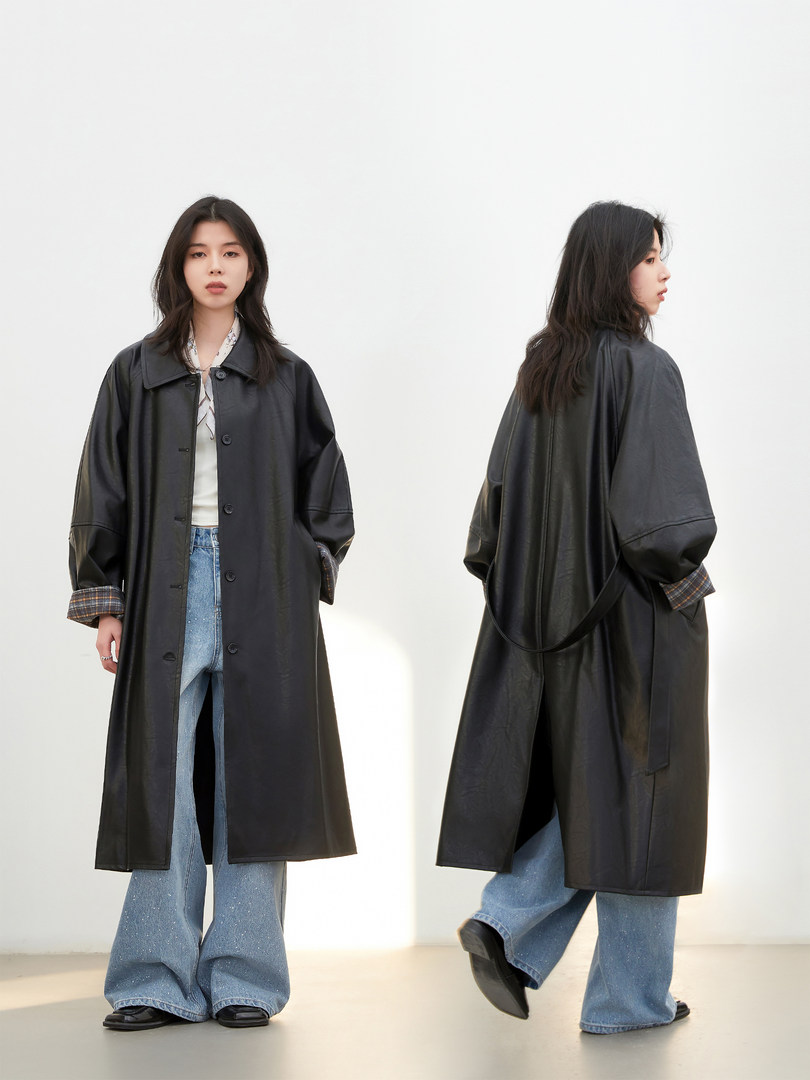 Black long oversized coat worn by a model in front and back views