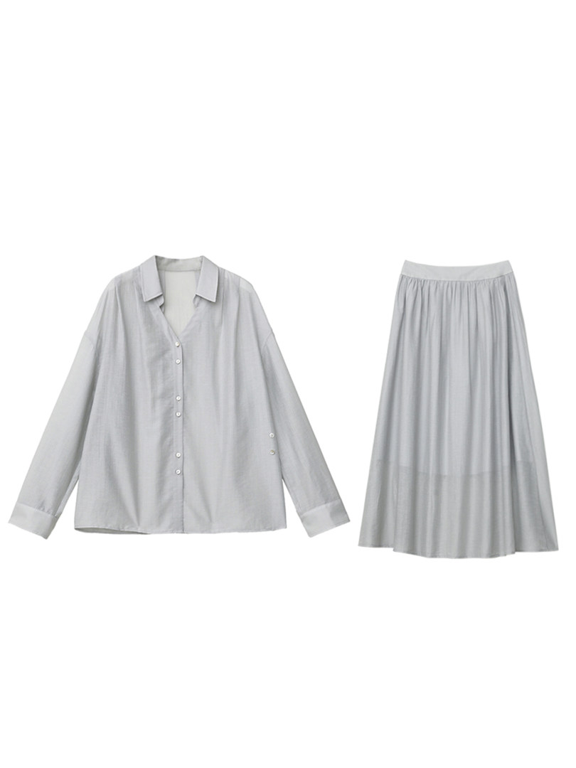 Light gray button-up shirt and matching pleated skirt set on a white background