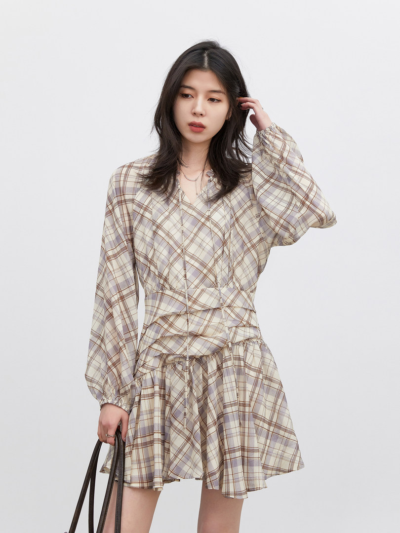 Model wearing a plaid long-sleeve mini dress