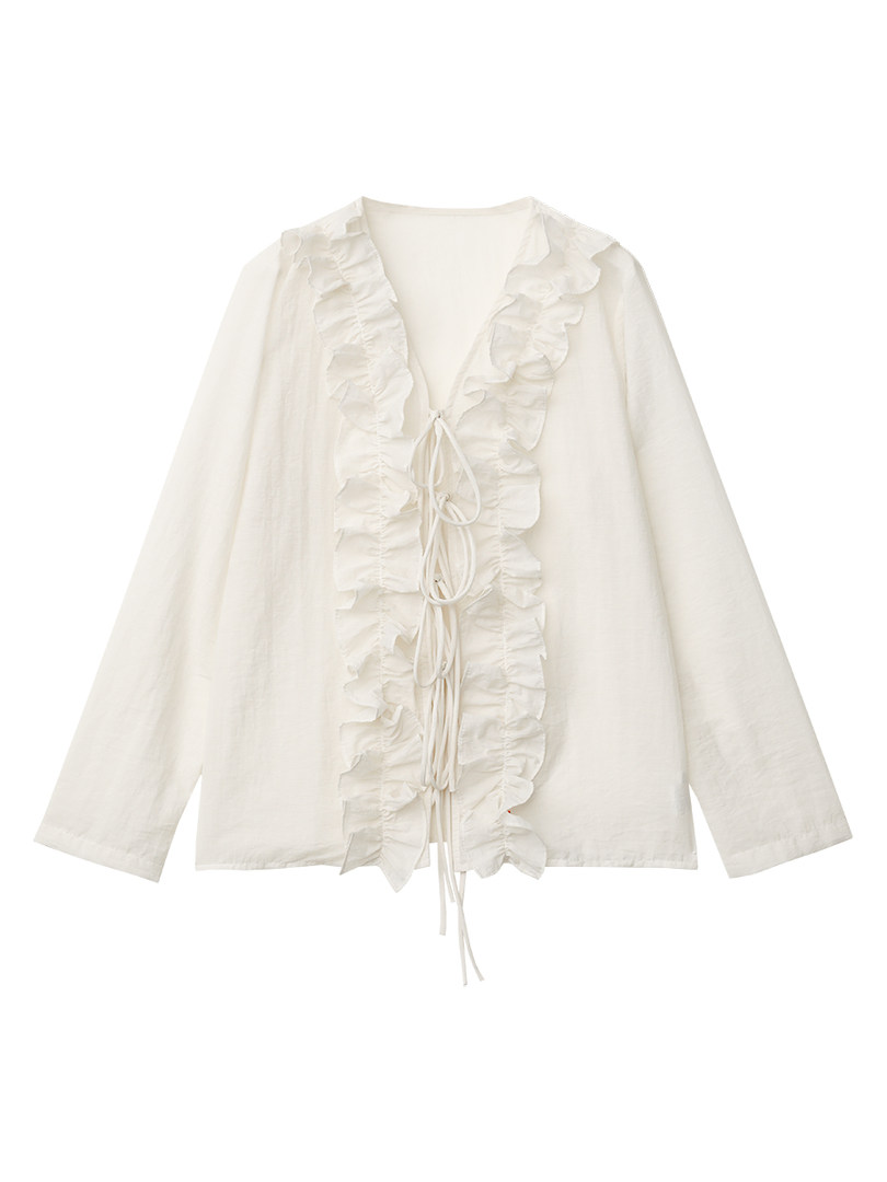 White ruffled tie-front blouse on a plain background