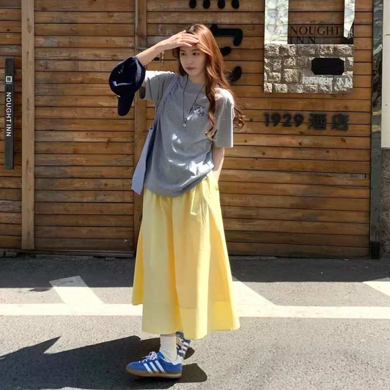 奶油黄半身裙少女多巴胺高腰中长款大摆伞裙设计感小众口袋a字裙