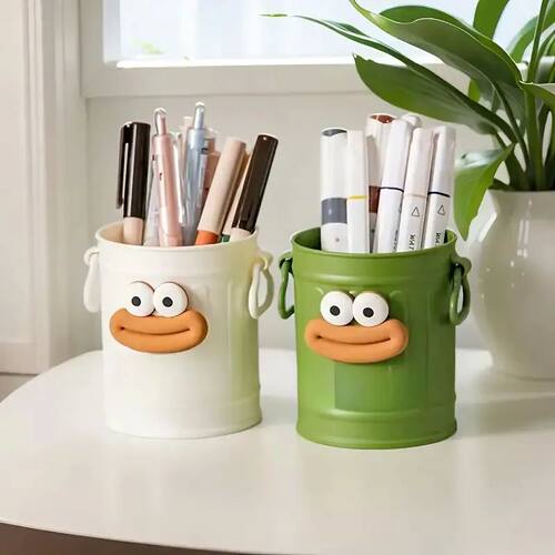Cute smiley face pen holder with expressive eyes and mouth -