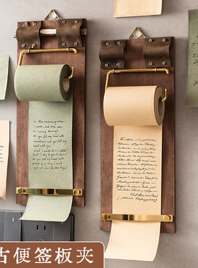 Wall-mounted sticky note holder, roll of sticky notes