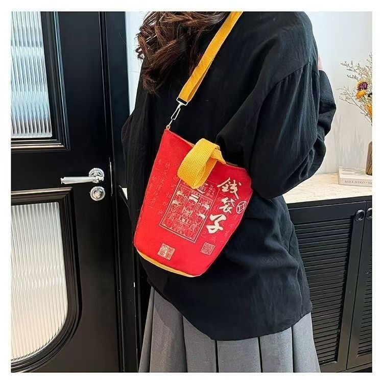 国潮风钱袋子斜挎包女帆布水桶包通用款女包