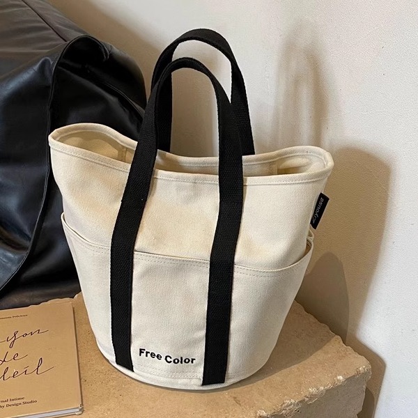 ins超火夏天帆布包女2024新款流行简约手腕大容量水桶手提托特包