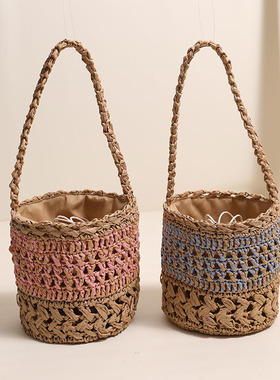 法式单肩水桶草编包新款小众镂空手提草包编织包女海边度假沙滩包