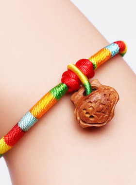 精雕桃核红绳手链