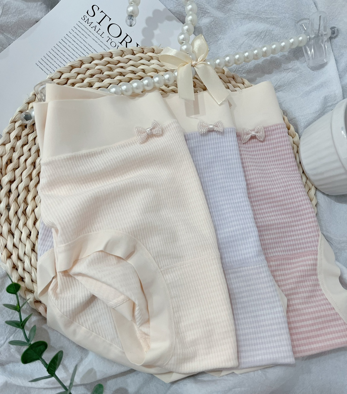 莫代尔亲肤棉柔中腰高弹薄款不夹臀透气包臀可爱蝴蝶结内裤女