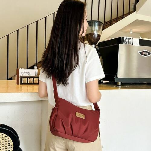 2026质量好高颜值饺子形女包双侧袋二拉链层单肩斜挎9.7寸平板包