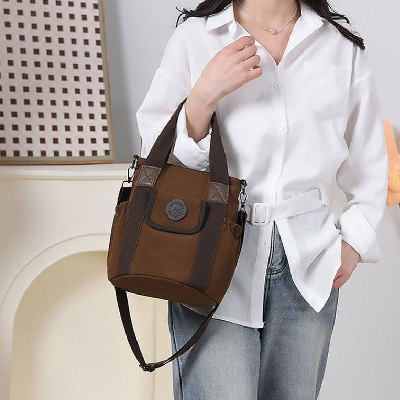 2026双侧水杯伞位方形布艺女式手提单肩斜挎9.7英寸平板伞小背包