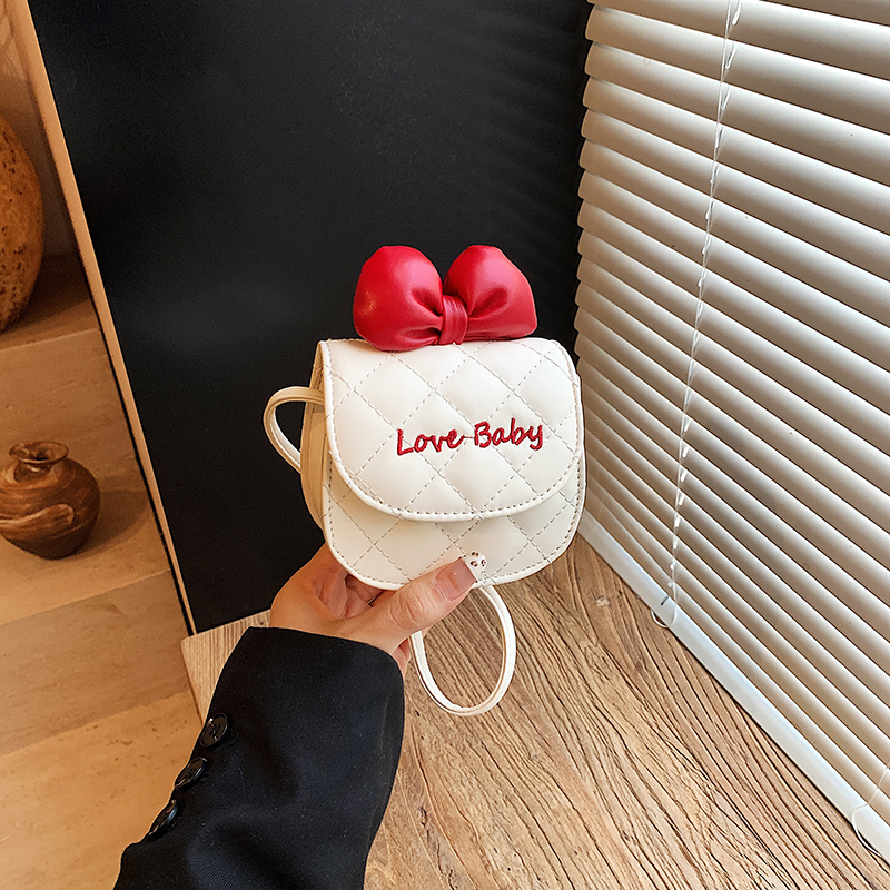 女童可爱卡通纯色蝴蝶结手拎包时尚新款公主宝宝韩系精致斜挎包潮