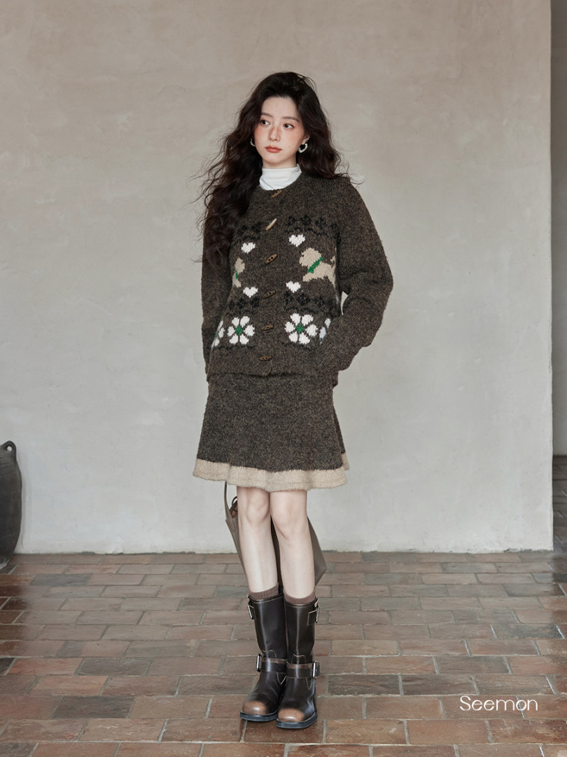 Model wearing a brown knit sweater and matching skirt with boots